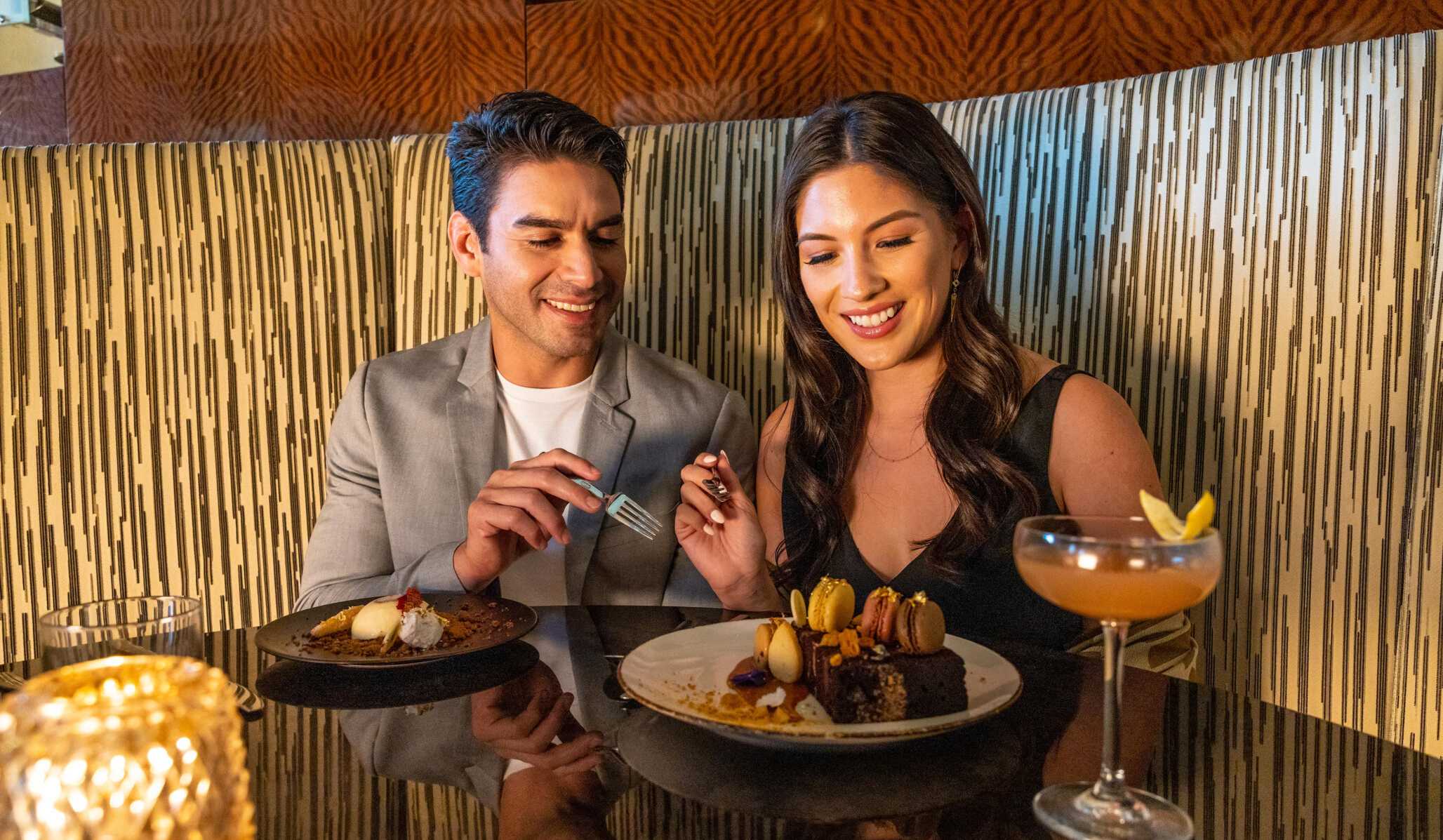 A couple enjoying dessert at Prime Cut Steakhouse & Seafood.
