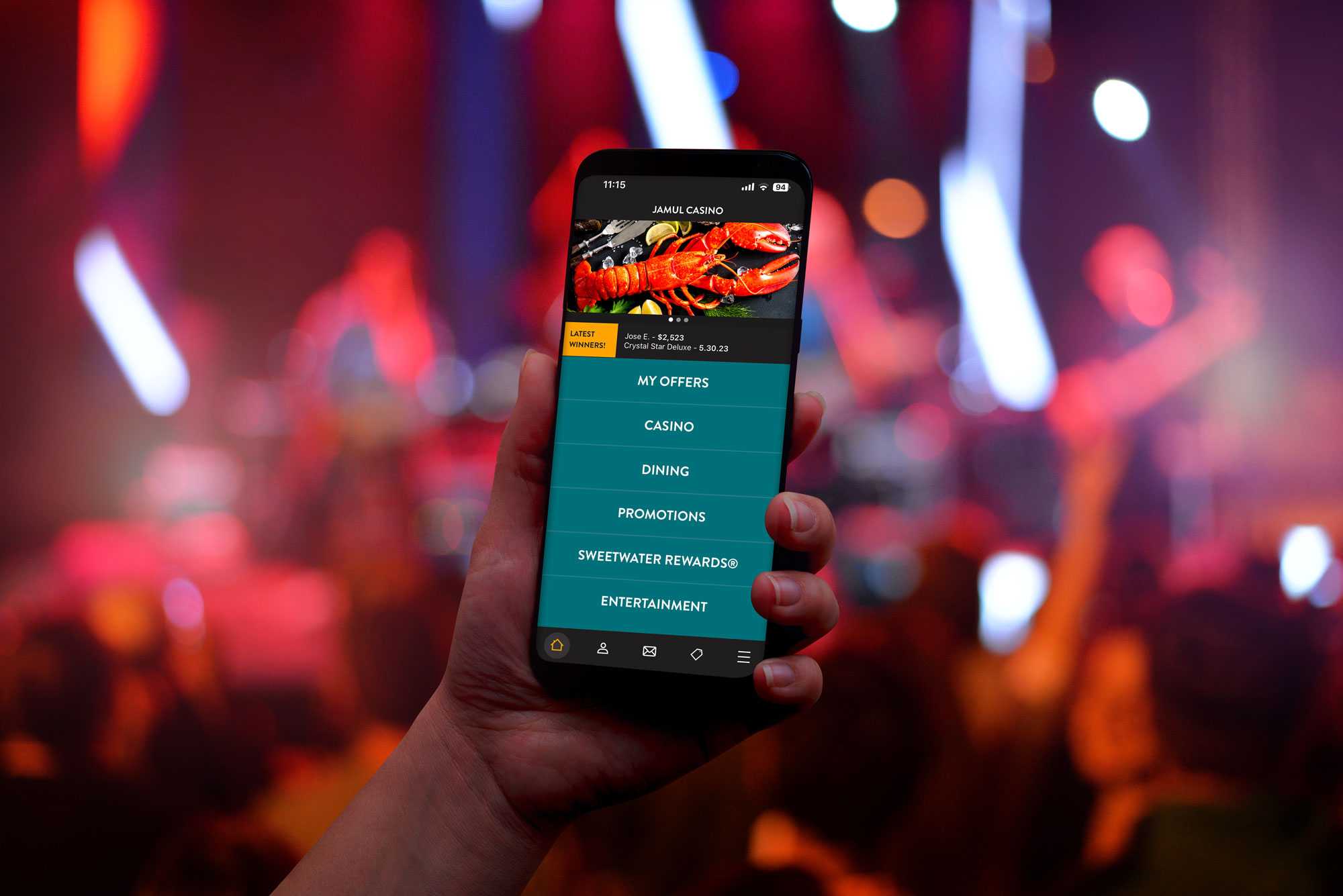Jamul Casino app open on a phone at a concert.